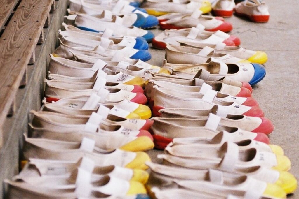 Rows of Uwabaki shoes left at the Genkan (traditional entryway) of a Japanese classroom