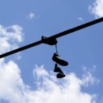 Why People Throw Shoes on Power Lines? The Real Reason