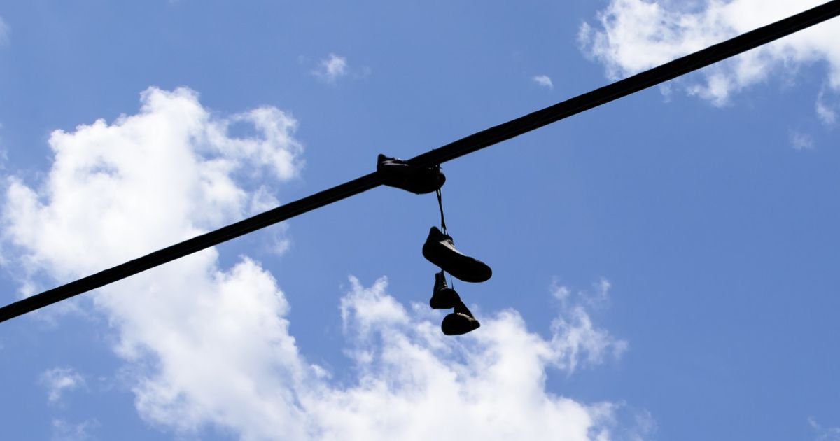 Why People Throw Shoes on Power Lines? The Real Reason